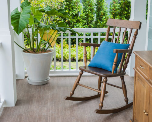 Wooden,Rocking,Chair,On,Front,Porch,With,Pillow