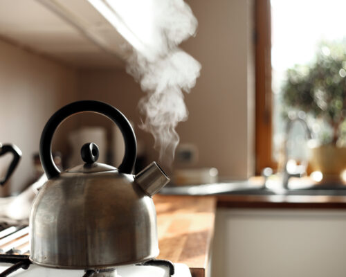 Steam,Coming,Out,Of,The,Kettle,In,The,Kitchen